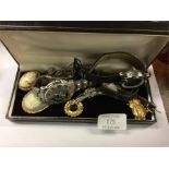 A box containing wristwatches, brooches etc.