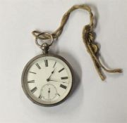 A silver engine turned pocket watch with white ena