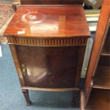 A mahogany bow front bedside cabinet.