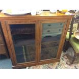 A two door glazed bookcase.