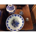An Oriental blue and white bowl, vase and teapot.