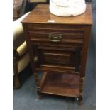 A small mahogany bedside chest.