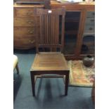 A set of four hardwood chairs.