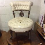 A small Edwardian button back chair.
