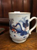 An Antique Oriental blue and white cup.