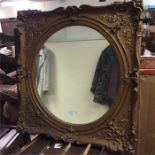 An old gilt framed mirror.