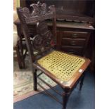 An Antique carved hall chair.