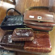 Old crocodile skin and other leather handbags.