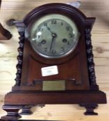A mahogany cased striking mantle clock.