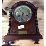 A mahogany cased striking mantle clock.