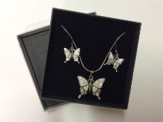 A silver and MOP butterfly pendant together with m
