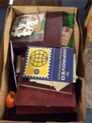 A box containing stamps and albums.