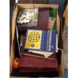 A box containing stamps and albums.