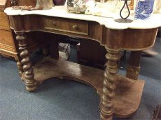 An old marble top and mahogany wash stand.