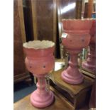 A pair of pink glass lustres.