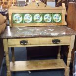 A stripped pine marble topped wash stand.