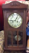 An oak framed mantle clock.