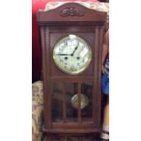 An oak framed mantle clock.