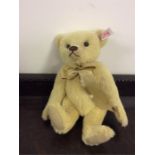 Steiff: A teddy bear with gilt bow numbered 662539