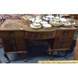 A good mahogany twin pedestal desk on ball and cla