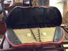 An old Oriental lacquered musical instrument.