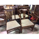 A set of four mahogany dining chairs.