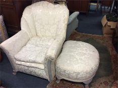 A white patterned armchair together with matching f