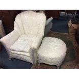 A white patterned armchair together with matching f