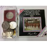 A box containing old commemorative coins etc.