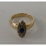 A high carat sapphire and diamond marquise shaped