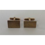 A pair of 14 carat gent's modernistic cufflinks. A