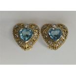 A pair of blue topaz and diamond heart shaped earr