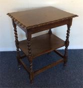 A small oak barley twist pie crust table. Est. £15