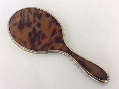 A good silver gilt and tortoiseshell hand mirror w