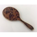 A good silver gilt and tortoiseshell hand mirror w