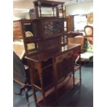 An Edwardian carved mirrored back sideboard with b