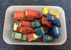 A box containing old Dinky and Corgi toy cars. Est