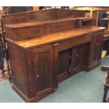 A massive mahogany break front sideboard withe bea