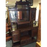 An Edwardian three drawer mirrored sideboard with