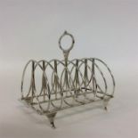 A good Georgian six bar toast rack with ring handl