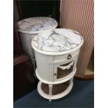 A pair of painted cane marble topped bedside cabin