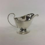 A single pedestal sauce boat with ball rim. Sheffi