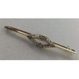 A gold and platinum bar brooch mounted with seed p