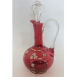A decorative Cranberry glass decanter with lift-of