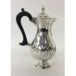 A half fluted baluster shaped water jug with hinge