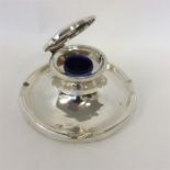 A massive capstan shaped inkwell with hinged top a