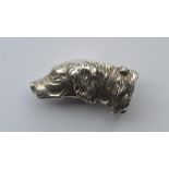 An unusual vesta in the form of a dog with hinged