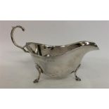 A silver sauce boat with leaf cap mounts. (Slight