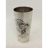 A stylish beaker with gilt interior embossed with