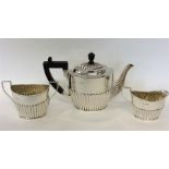 A small bachelor's three piece half fluted tea ser